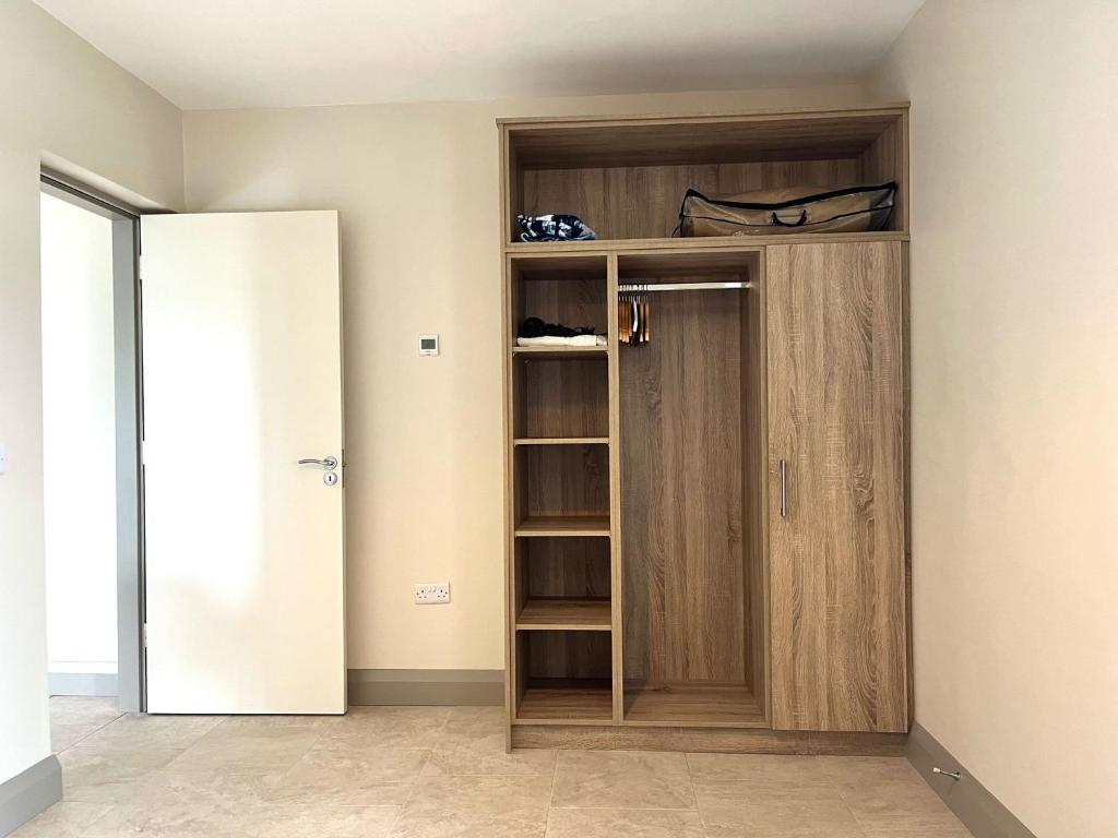 a closet in a room with a door at Tigh Fitz Apartments - Inis Mór, Aran Island in Inis Mor