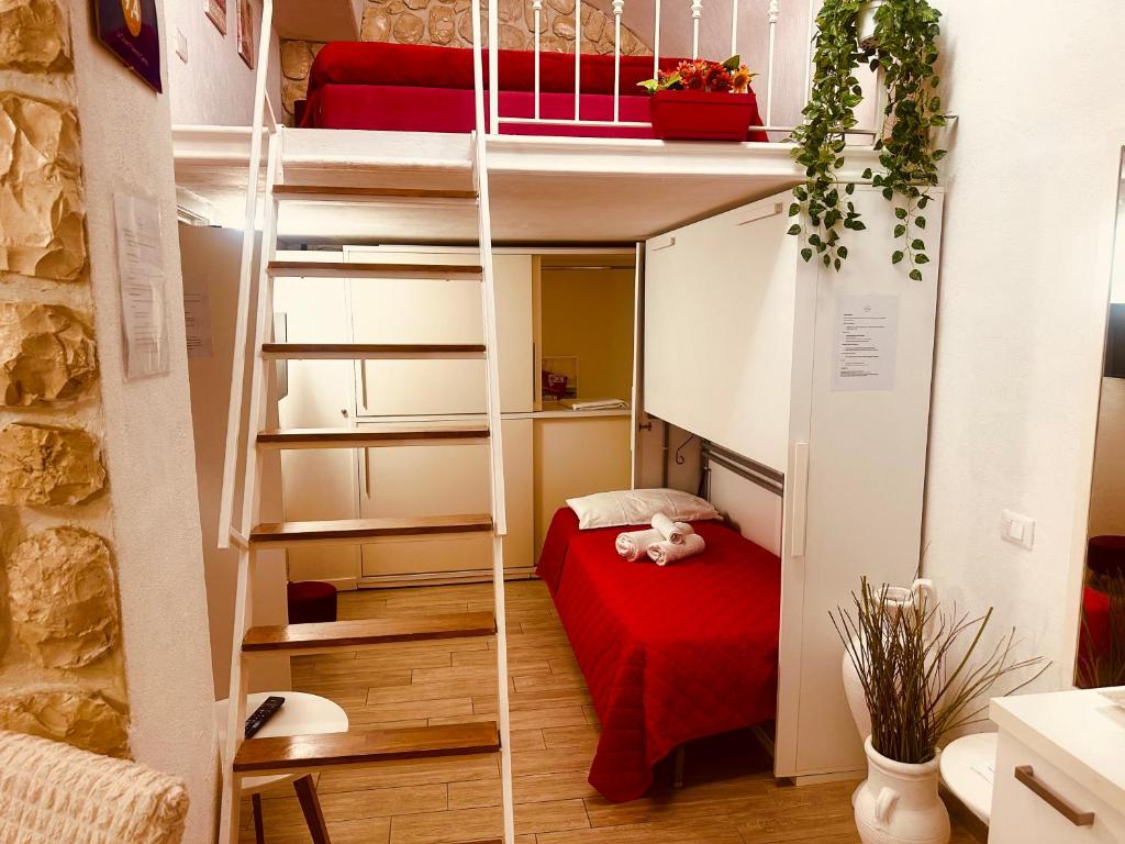 A bed or beds in a room at Le Chalet Palermo Centro