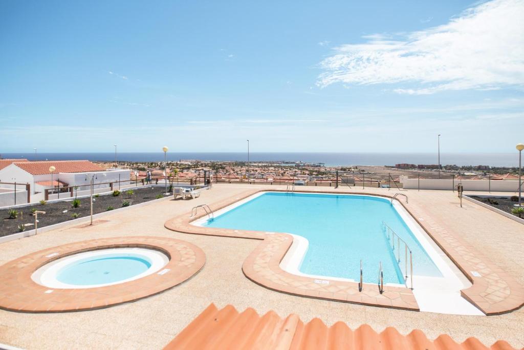 The swimming pool at or close to Caleta Beach Deluxe