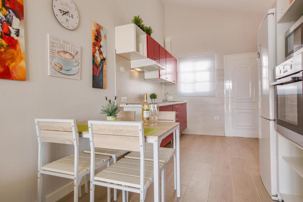 A kitchen or kitchenette at Caleta Beach Deluxe