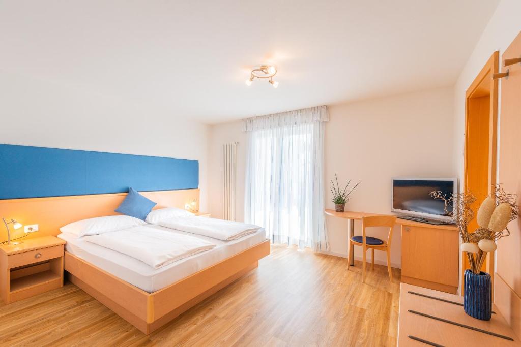 Postel nebo postele na pokoji v ubytování B&B Garni Erika