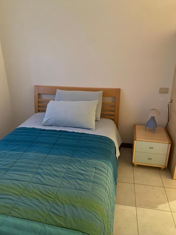 Postel nebo postele na pokoji v ubytování Mini appartamento blu