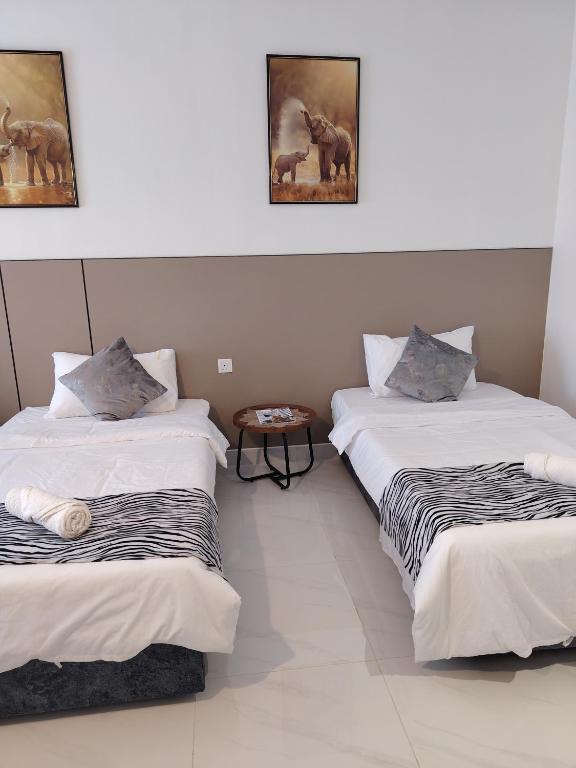 Postel nebo postele na pokoji v ubytování HyzEN StUdio, Executive Suite Room