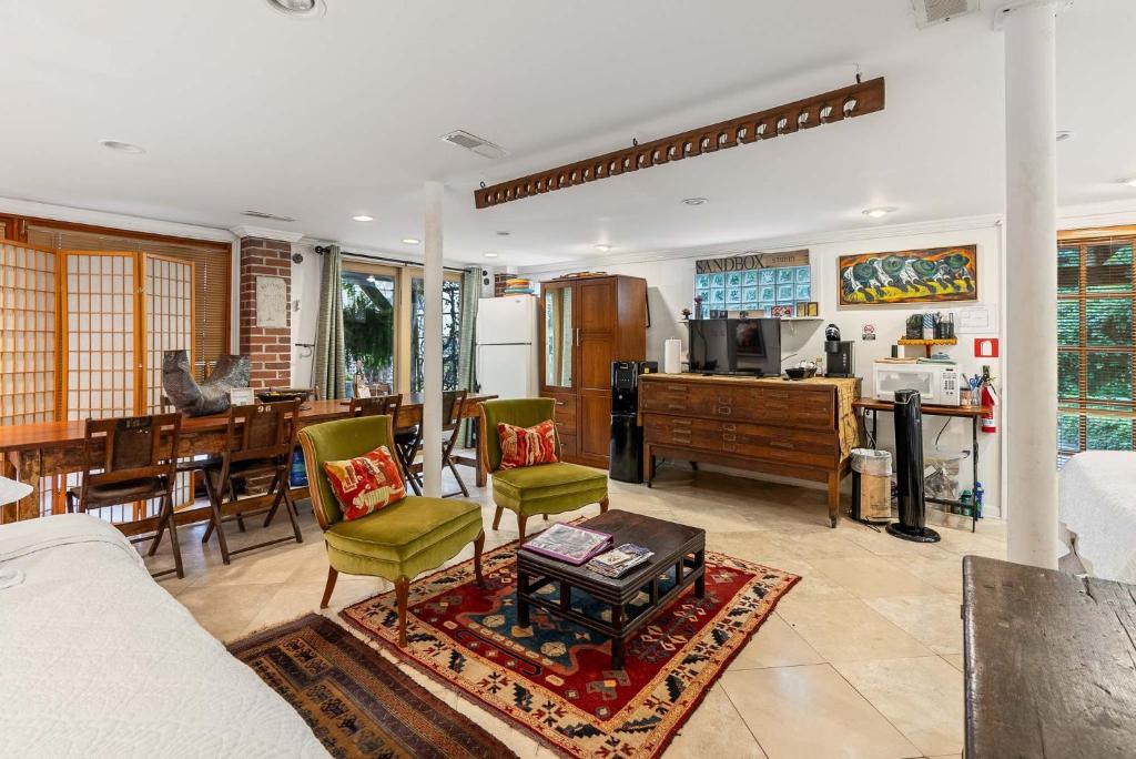 a living room with a kitchen and a dining room at La Petite Fleur-Charming Park Circle Private Studio in Charleston