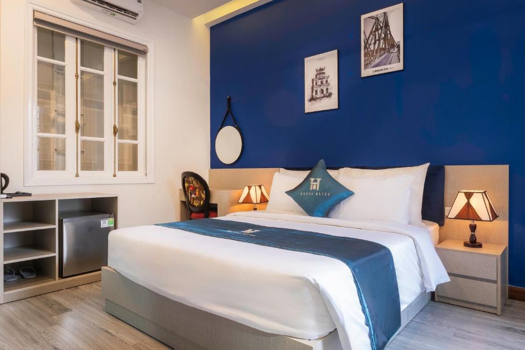 Postel nebo postele na pokoji v ubytování Hanoi Bliss Tran Hung Dao