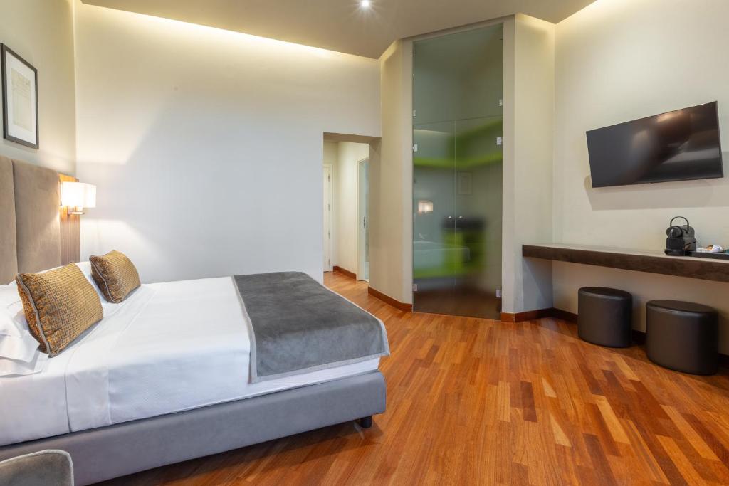 Postel nebo postele na pokoji v ubytování Hotel Embassy