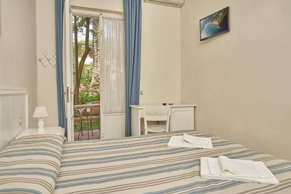 Postel nebo postele na pokoji v ubytování Hotel Villa Rodriguez