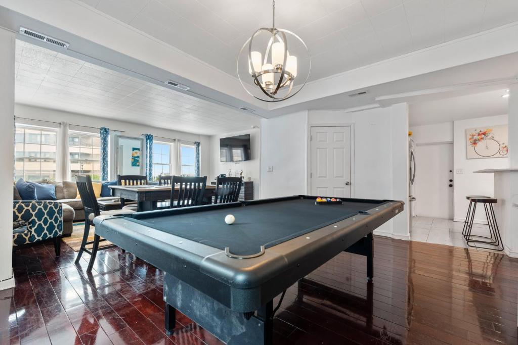 a living room with a pool table in it at Oversized Family Beach Block Duplex with Game Room in Atlantic City