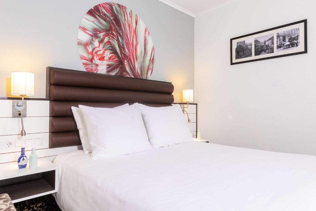 Postel nebo postele na pokoji v ubytování Golden Tulip Hotel Central