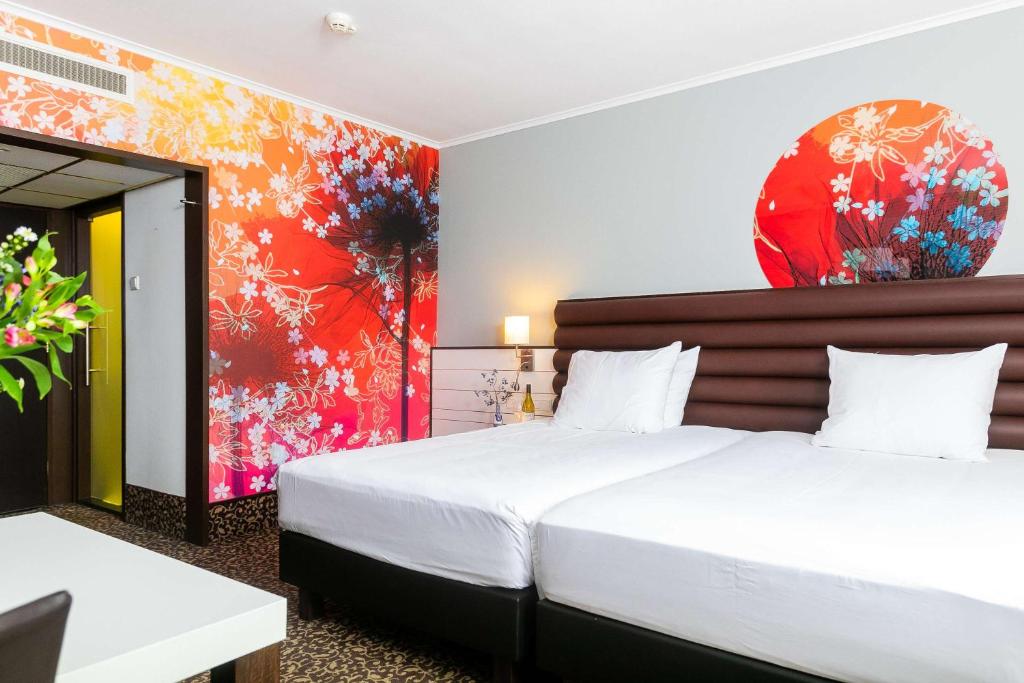 Postel nebo postele na pokoji v ubytování Golden Tulip Hotel Central