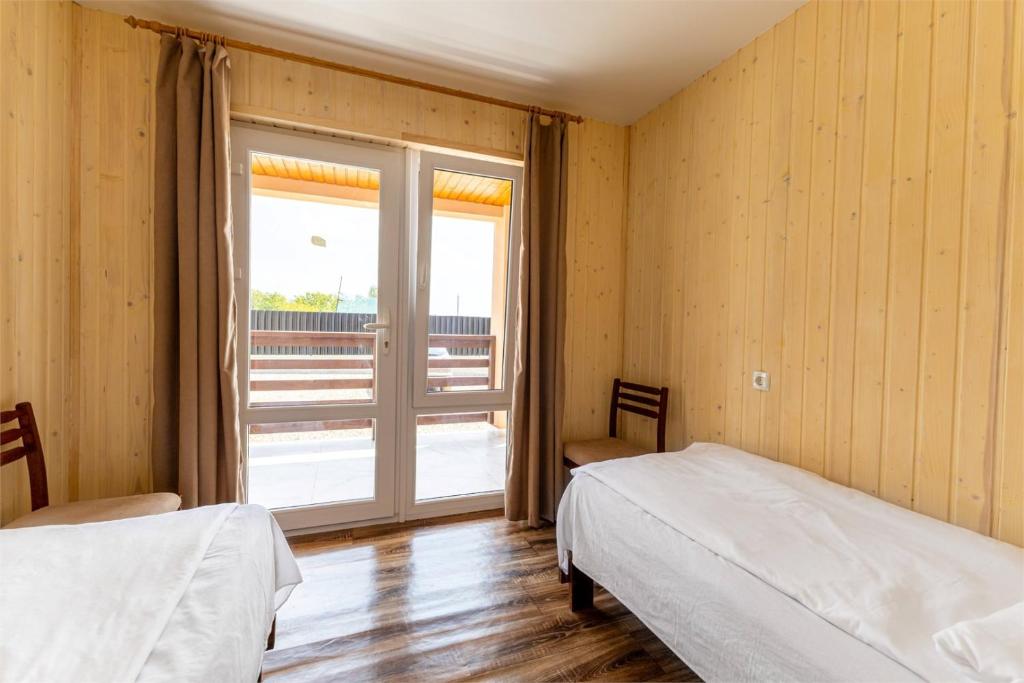 Postel nebo postele na pokoji v ubytování Hotel Halas