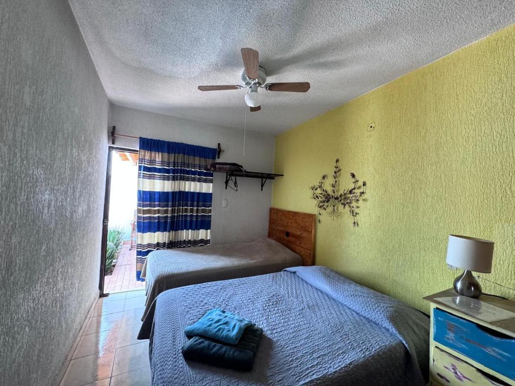 Postel nebo postele na pokoji v ubytování Casona Luciérnaga-Casa de Huéspedes