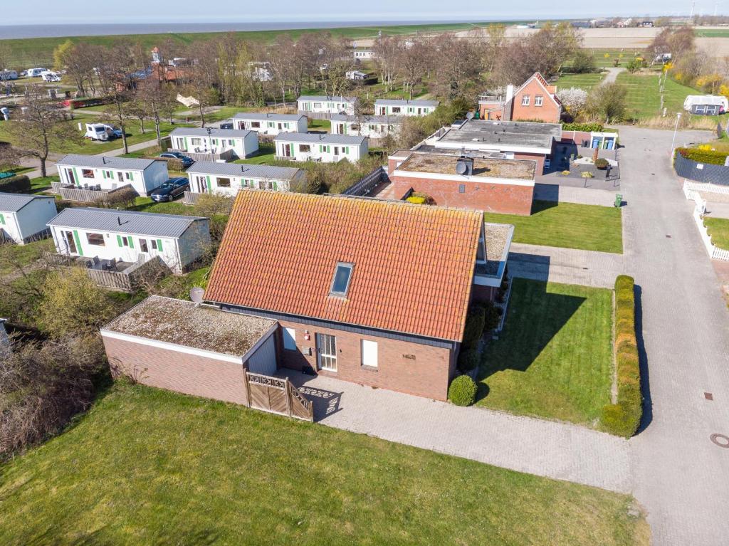 an aerial view of a house with an orange roof at Watt'n Mehr in Krummhörn