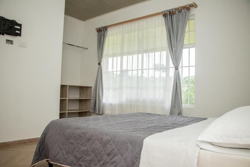 Postel nebo postele na pokoji v ubytování Villa Alfonso