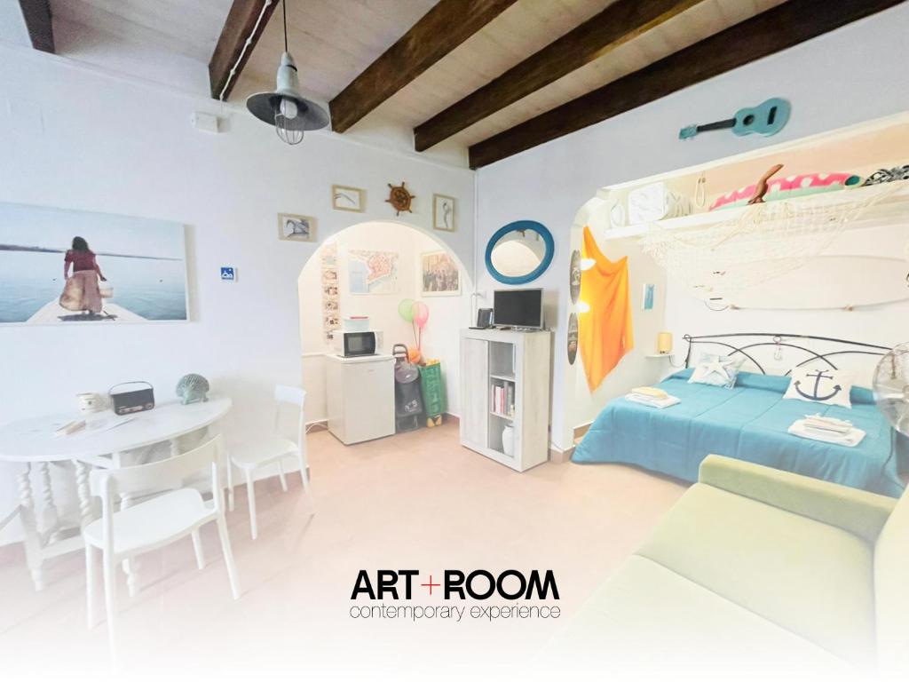 Una cama o camas en una habitación de Gaudì Art Room Studio Apartment