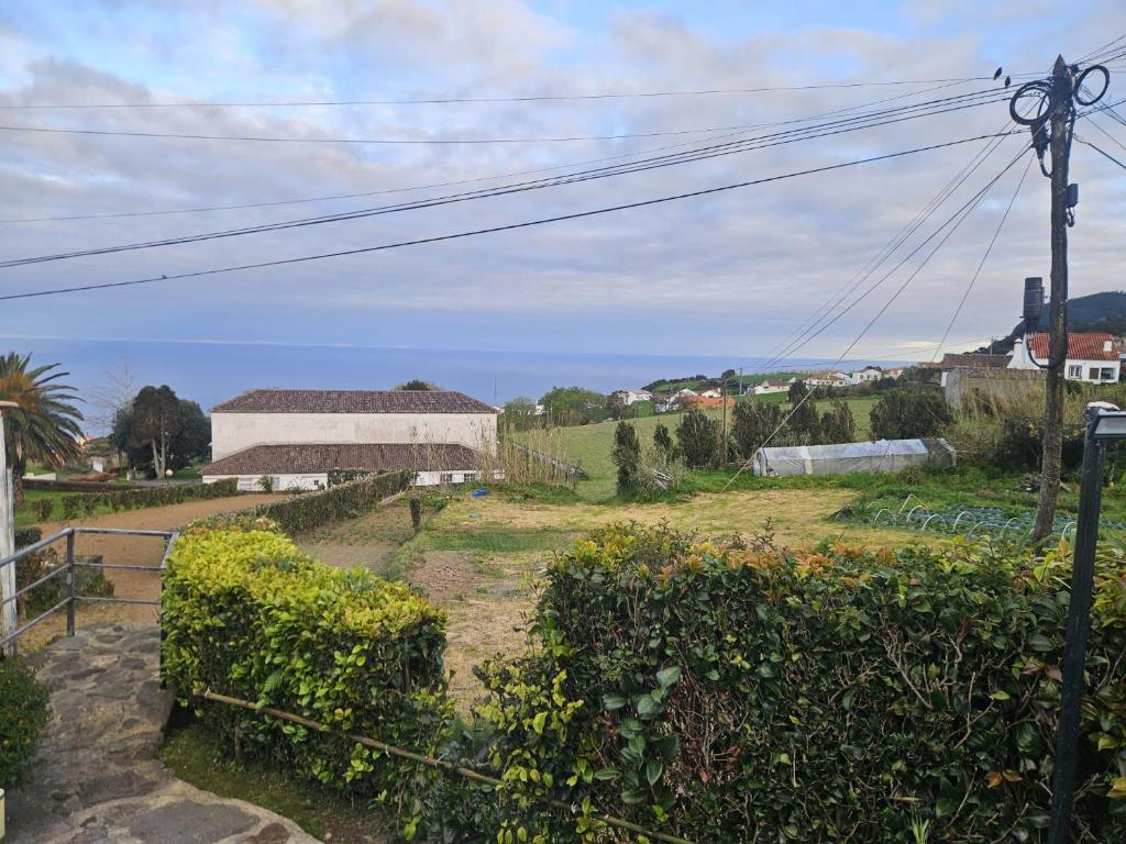 a view of a yard with bushes and a building at Casa Vista da Marquesa in Nordeste