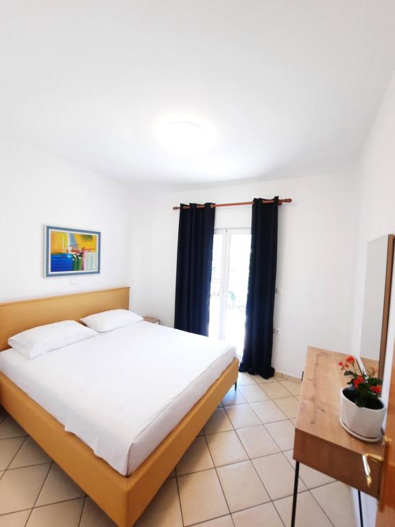 Кровать или кровати в номере Amarildo Hotel