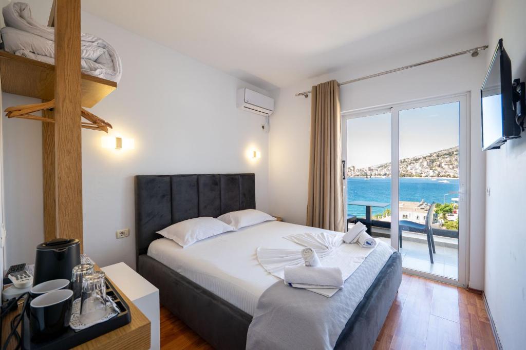 Postel nebo postele na pokoji v ubytování Hotel Vola