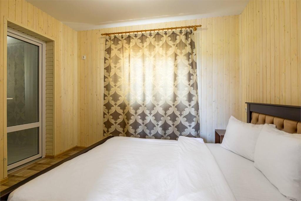 Postel nebo postele na pokoji v ubytování Hotel Halas
