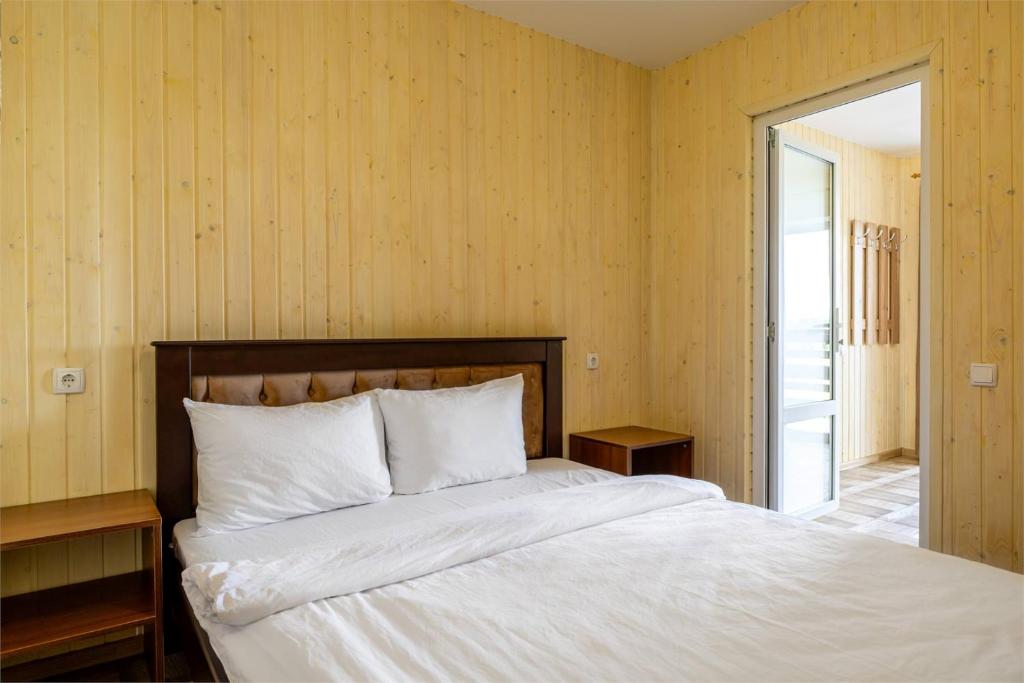 Postel nebo postele na pokoji v ubytování Hotel Halas