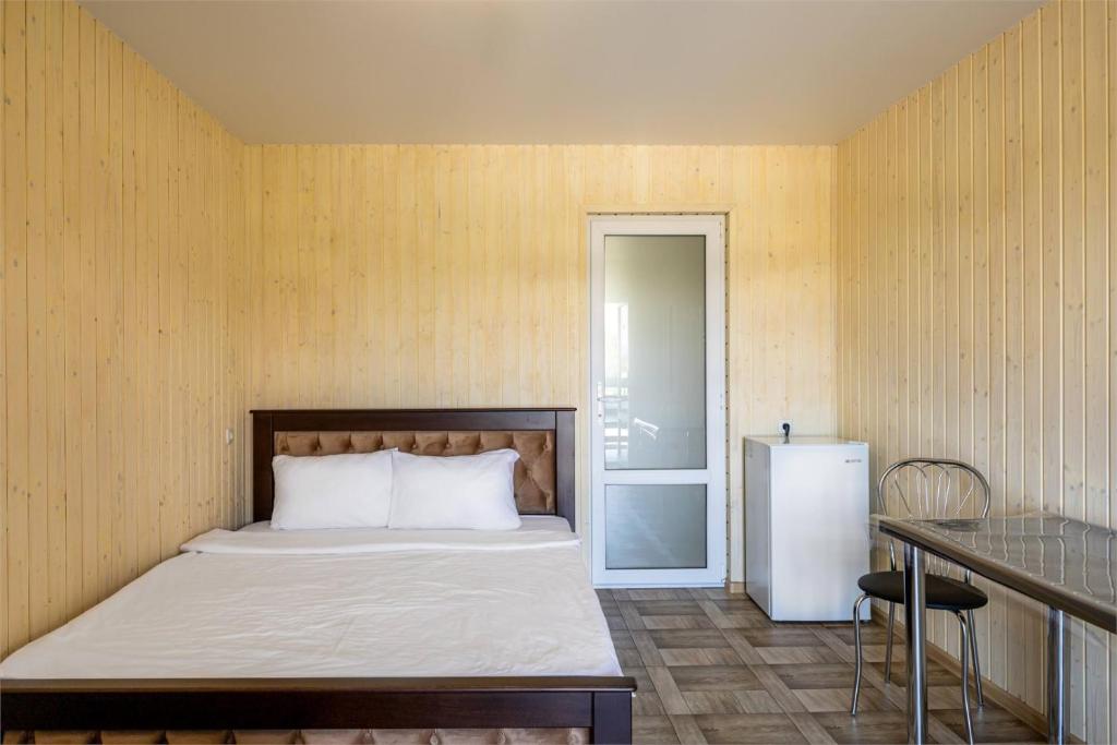 Postel nebo postele na pokoji v ubytování Hotel Halas