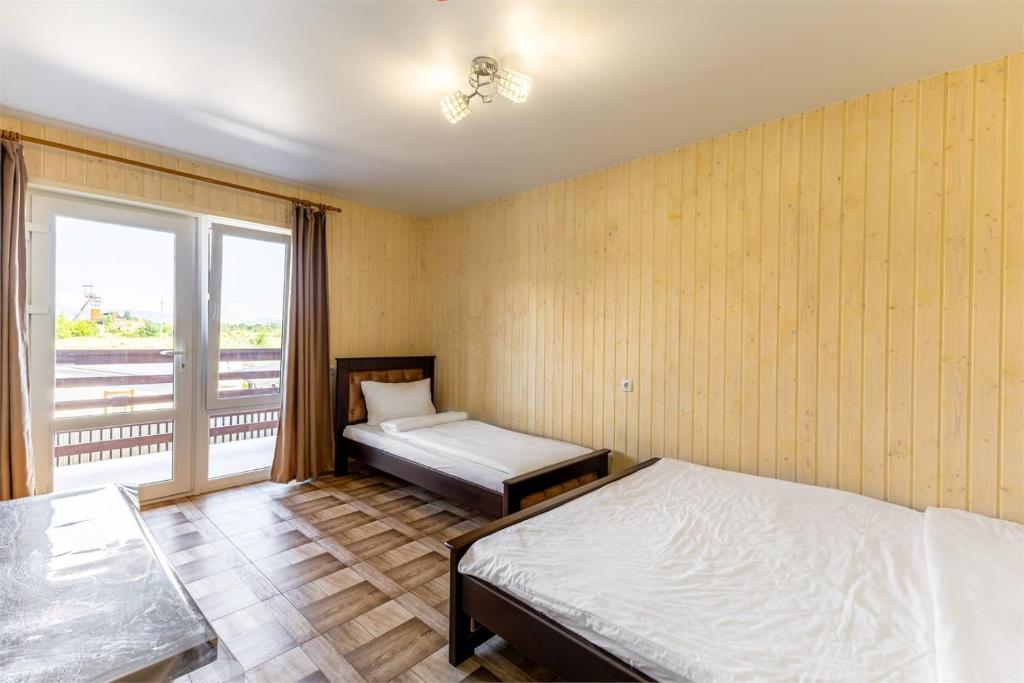 Postel nebo postele na pokoji v ubytování Hotel Halas
