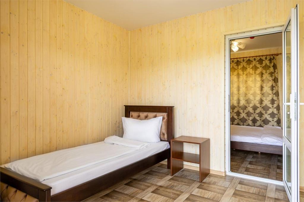 Postel nebo postele na pokoji v ubytování Hotel Halas