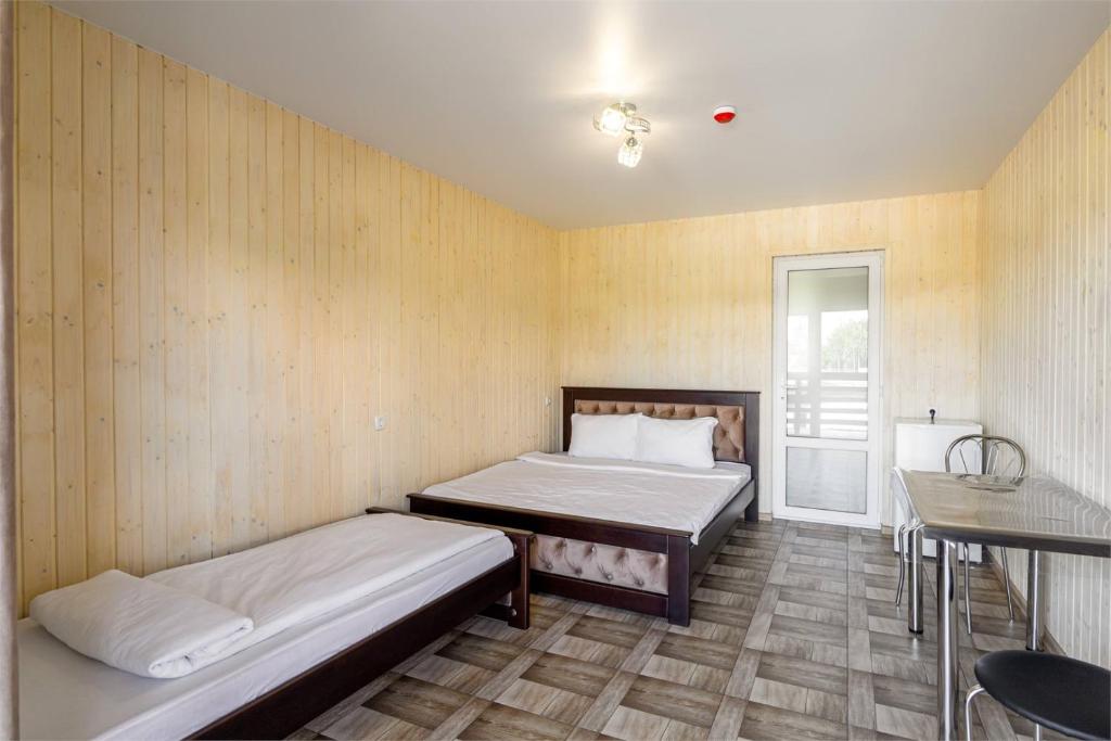 Postel nebo postele na pokoji v ubytování Hotel Halas