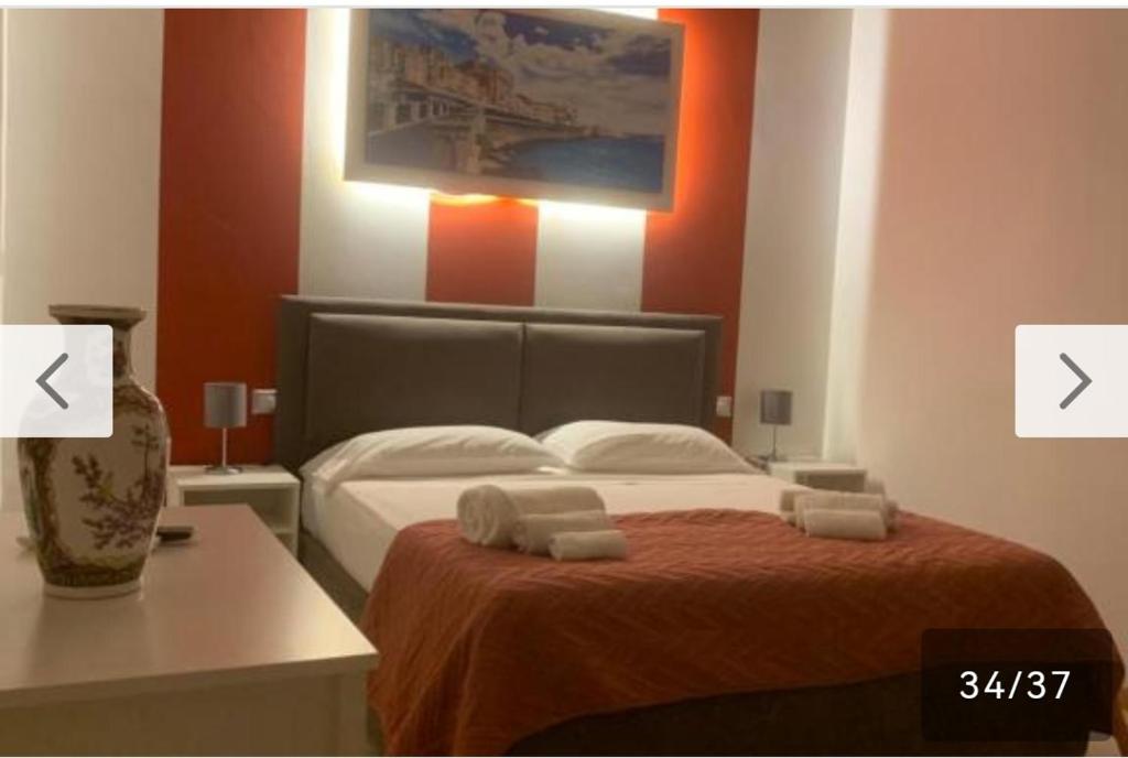Postel nebo postele na pokoji v ubytování Mille e una notte house
