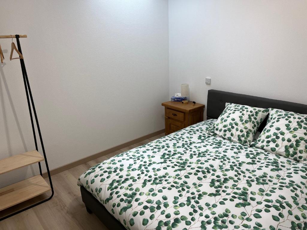 Postel nebo postele na pokoji v ubytování l ancienne ecurie