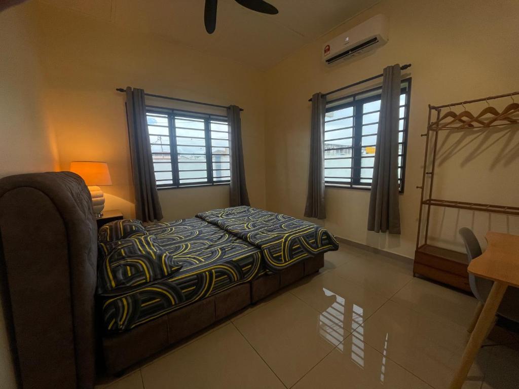 Postel nebo postele na pokoji v ubytování PD Coral cove homestay