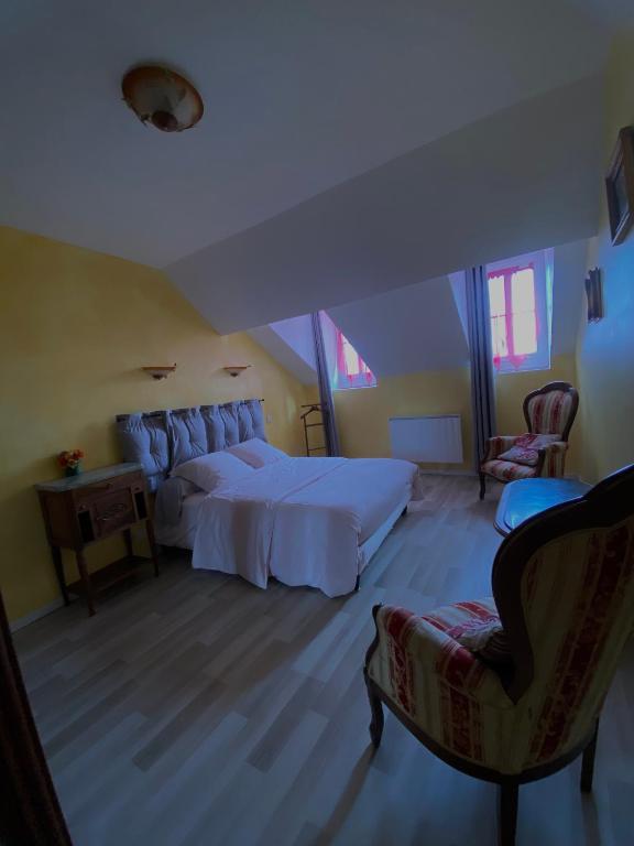 Postel nebo postele na pokoji v ubytování Au Pied du Chateau