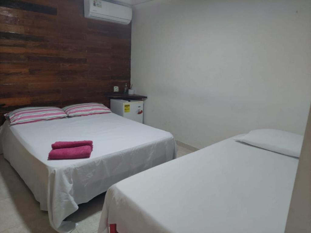 Postel nebo postele na pokoji v ubytování Raizal house