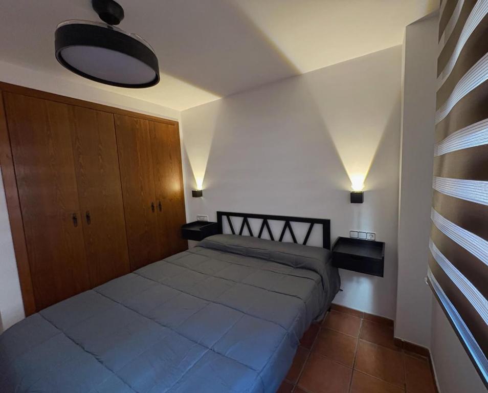 a bedroom with a large bed in a room at Exclusive apartment with a terrace in Mora de Rubielos