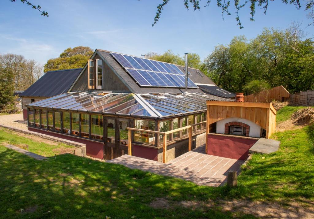 a house with solar panels on the roof at The Barn - Brynberian, Eglwyswrw in Eglwyswrw