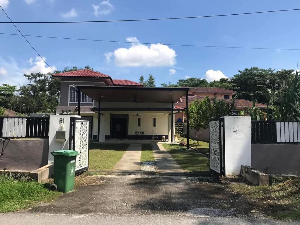 a house with a gate in front of it at Serendipity Resthouse in Rawang