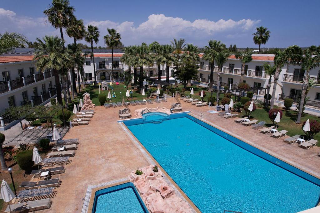 an overhead view of a swimming pool at a hotel at Loutsiana Deluxe Apts in Ayia Napa