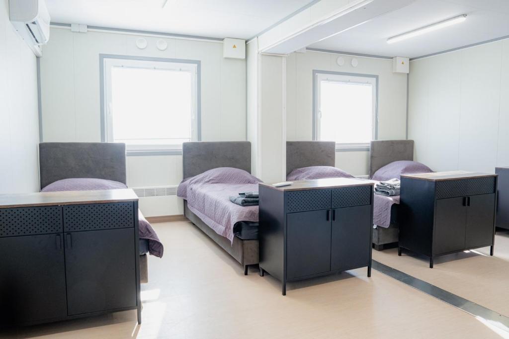 Postel nebo postele na pokoji v ubytování Pabrades Apartamentai