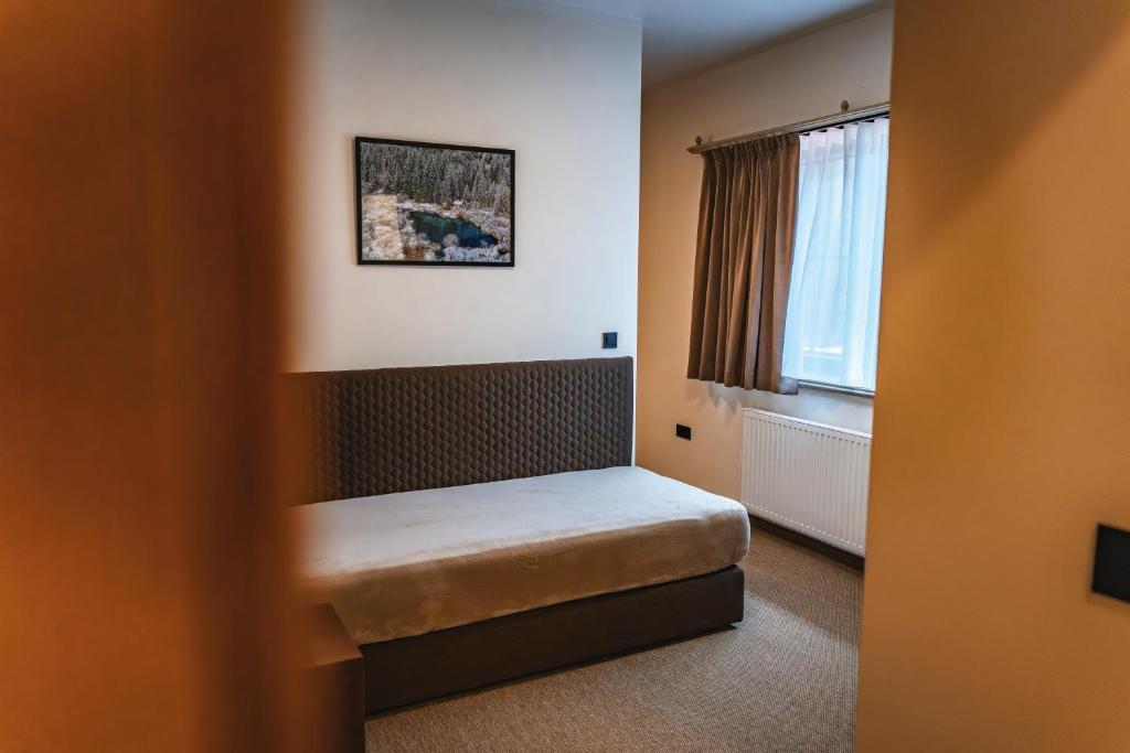 Postel nebo postele na pokoji v ubytování Guest House EJGA