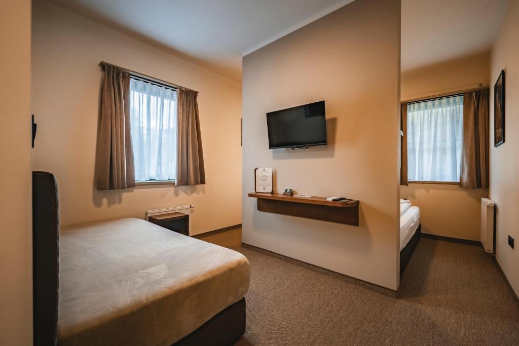 Postel nebo postele na pokoji v ubytování Guest House EJGA