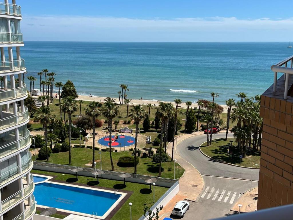 a view of the beach from the balcony of a building at Costa Marina III - Vistas inmejorables in El Borseral