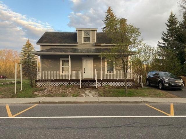 a house with a car parked in front of it at 891 shefford 4-bedroom house in Bromont