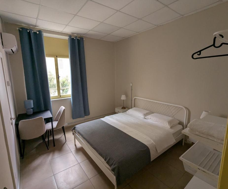 Postel nebo postele na pokoji v ubytování Nest House