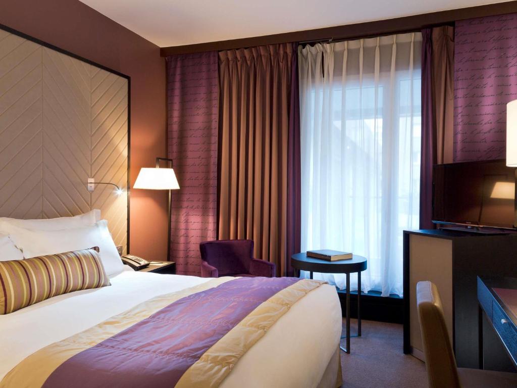 Postel nebo postele na pokoji v ubytování Sofitel Strasbourg Grande Ile