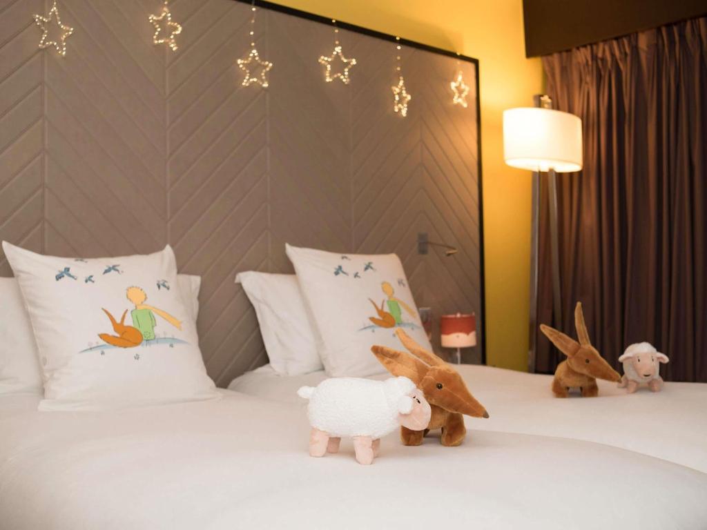 Postel nebo postele na pokoji v ubytování Sofitel Strasbourg Grande Ile