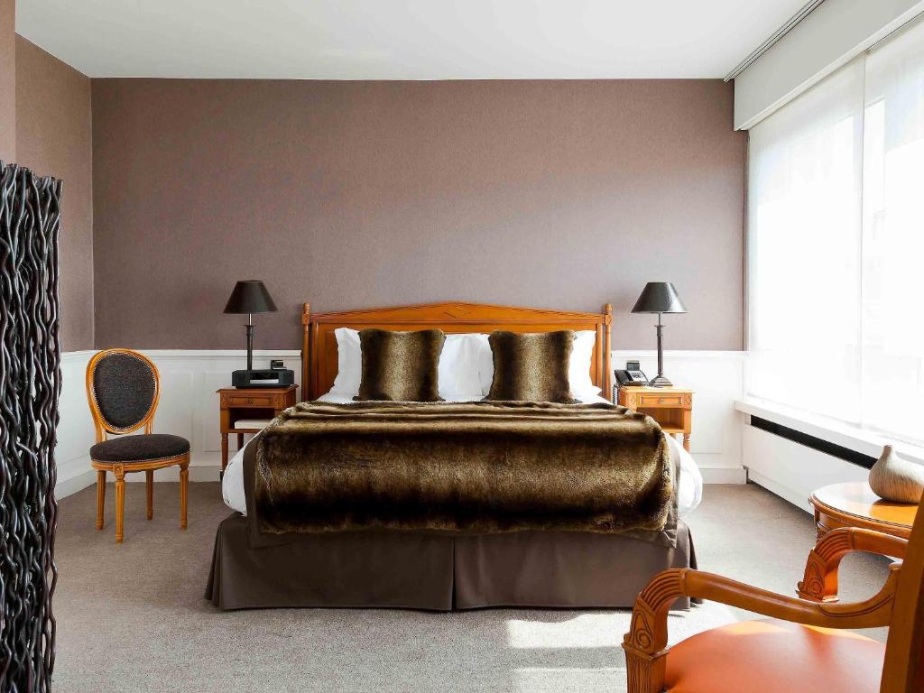 Postel nebo postele na pokoji v ubytování Sofitel Strasbourg Grande Ile