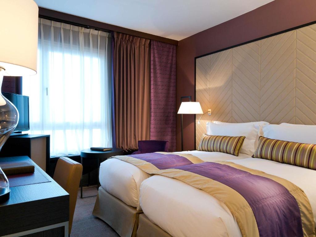 Postel nebo postele na pokoji v ubytování Sofitel Strasbourg Grande Ile