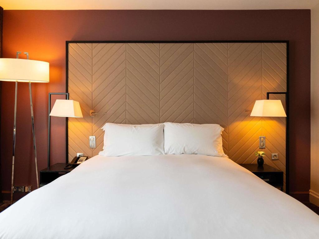 Postel nebo postele na pokoji v ubytování Sofitel Strasbourg Grande Ile
