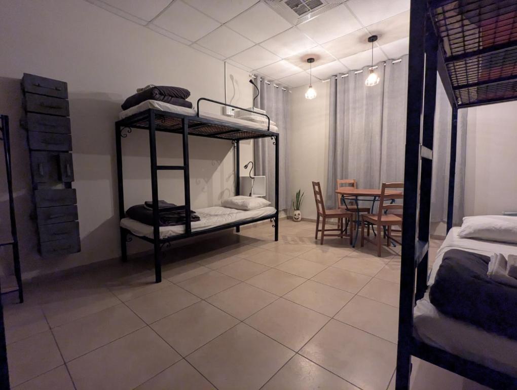 Postel nebo postele na pokoji v ubytování Nest House