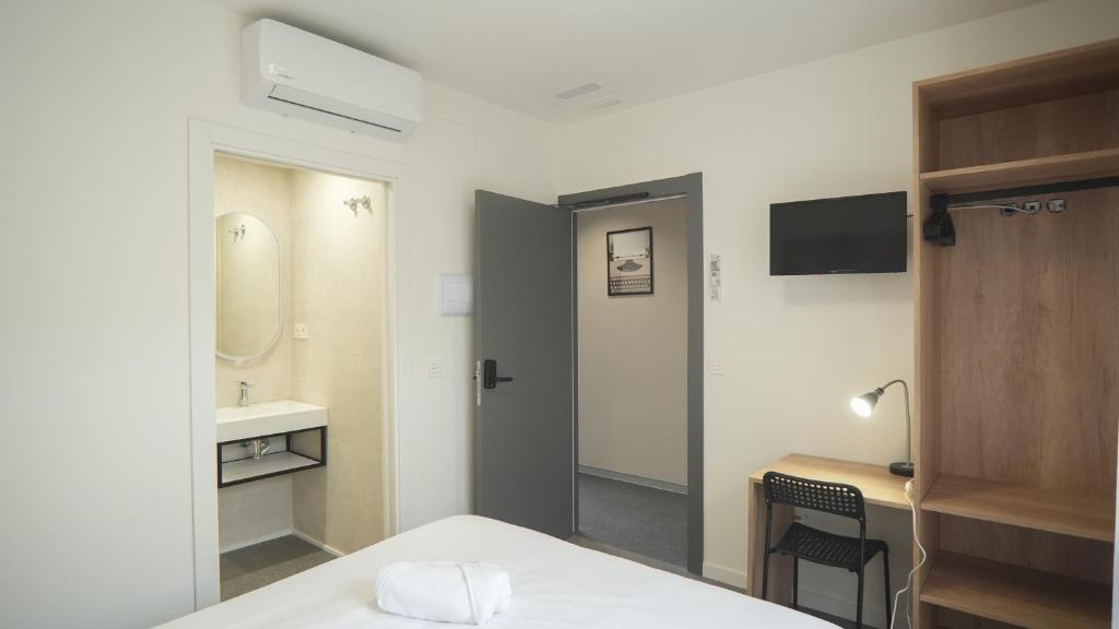 Postel nebo postele na pokoji v ubytování Hostal Calaya